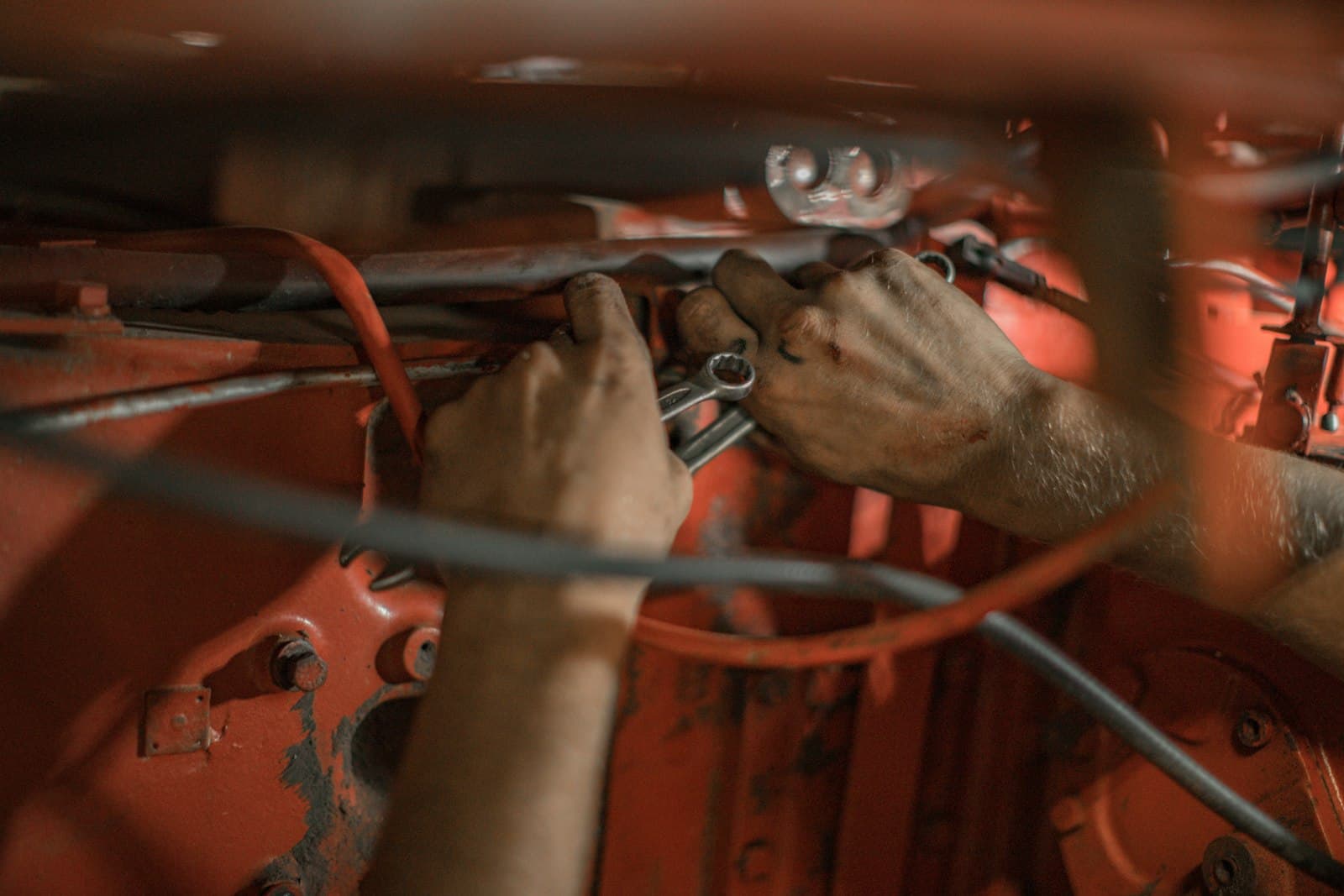A tradesperson holding a red metal frame