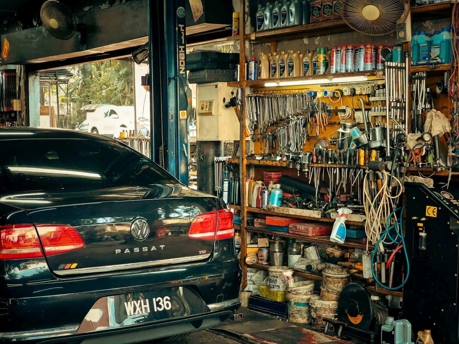 A car parked outside a small shop